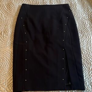 White House Black Market black wool skirt with studded detail.